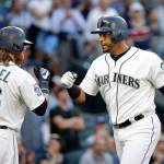 The Mariners&rsquo; Nelson Cruz (right) is congratulated by Ben Gamel after hitting a home run against the Royals in a baseball game July 5, 2017, in Seattle. (AP Photo/Elaine Thompson)