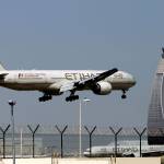 In this May 4, 2014 file photo, an Etihad Airways plane prepares to land at the Abu Dhabi airport in the United Arab Emirates. The capital of the United Arab Emirates became the first city to find itself exempt from a U.S. ban on laptop computers being in airplane cabins, the country&rsquo;s flag carrier said Sunday. (AP Photo/Kamran Jebreili, File)