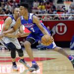 Philadelphia 76ers guard Markelle Fultz (7) drives around Utah Jazz guard Dante Exum during the first half of an NBA Summer League game Wednesday in Salt Lake City. (AP Photo/Rick Bowmer, File)