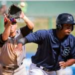 Everett&rsquo;s Brayan Hernandez is caught in a pickle with Salem-Keizer&rsquo;s Orlando Garcia chasing from second base Sunday afternoon at Everett Memorial Stadium in Everett on July 9, 2017. Salem-Keizer won 7-6. (Kevin Clark / The Herald)