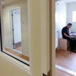 Scott Johnson, detox director, takes a break in a detox room during the dedication of the Evergreen Recovery Center in Lynnwood on June 28. (Kevin Clark / The Herald)