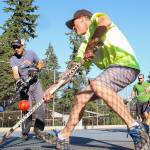 From left to right, Joe Baumgart, Doug Wickman, Jake Adams and Jay Stein-Trujillo practice with their street hockey team on July 6, 2017, at Forest Park in Everett. (Kevin Clark / The Herald)