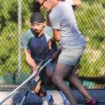 Jose Preito (left) and Brandy Maychrzak practice with their street hockey team on July 6, 2017, at Forest Park in Everett. (Kevin Clark / The Herald)