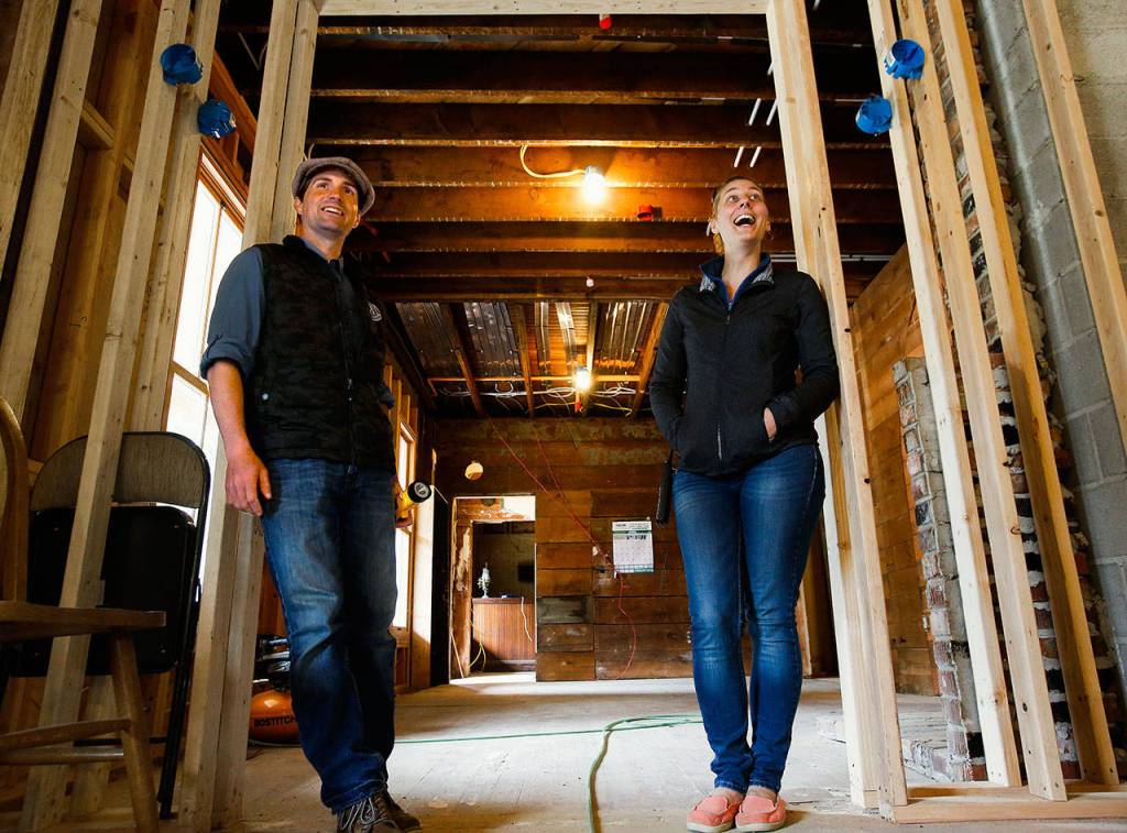 With light hearts and easy smiles, Blair and Kathy Corson appear to handle the many difficulties of reconstructing a 118-year-old hotel. (Dan Bates / The Herald)