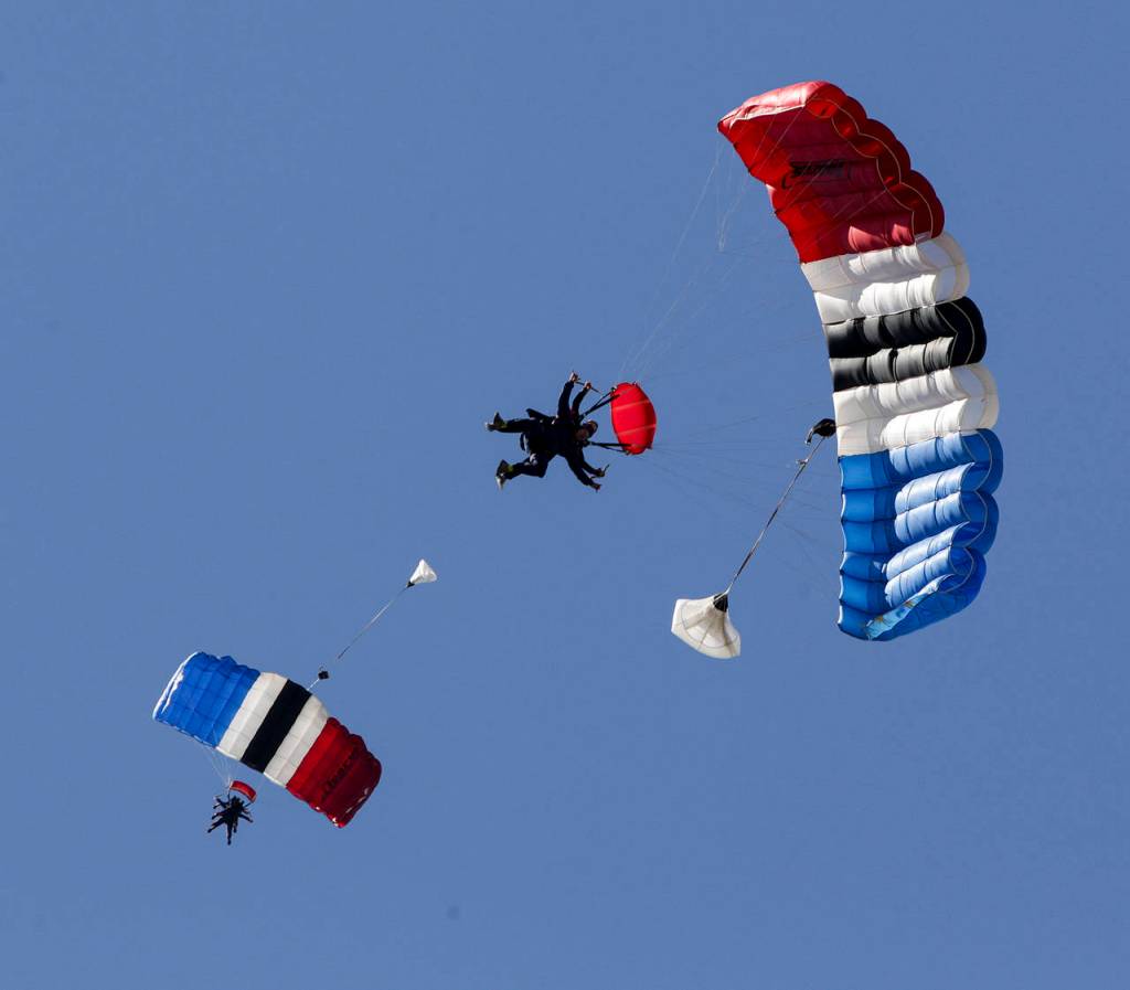 Skydivers float back to the ground after deploying their parachutes at Skydive Snohomish on Saturday, July 1. (Ian Terry / The Herald)