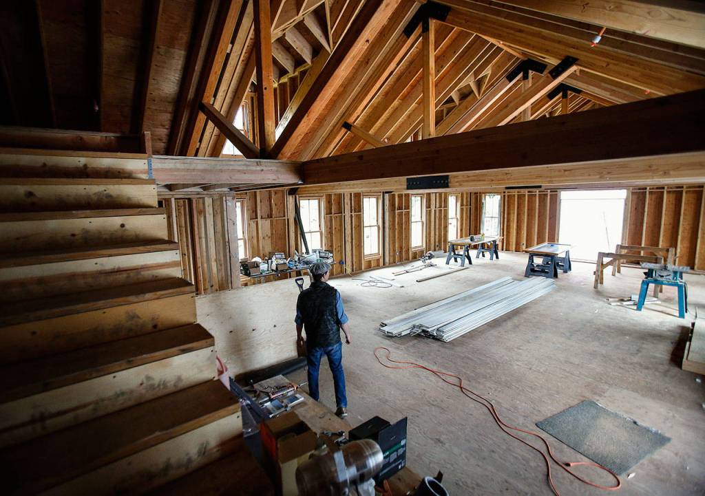 Blair Corson looks over a large addition he built on the back side of the hotel that will accommodate events like weddings and other large gatherings. (Dan Bates / The Herald)