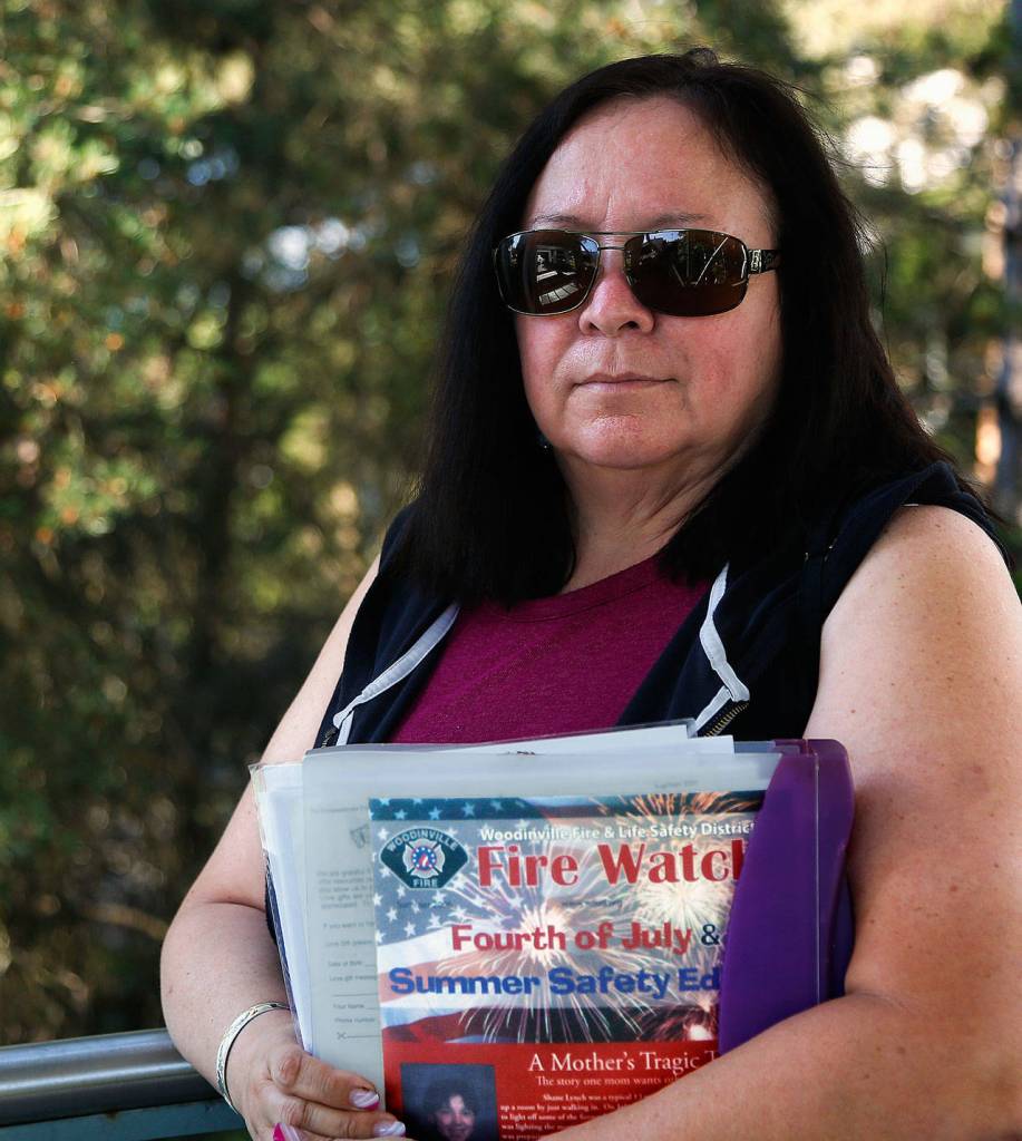 Glenda Lynch, of Lake Stevens, carries and shares a notebook filled with critical information about the dangers of fireworks as well as the tragic story of her son Shane, who was 13 when he was struck in the head by a mortar shell-type firework. He suffered major brain trauma and died 13 days later on July 16, 1999. (Dan Bates / The Herald)