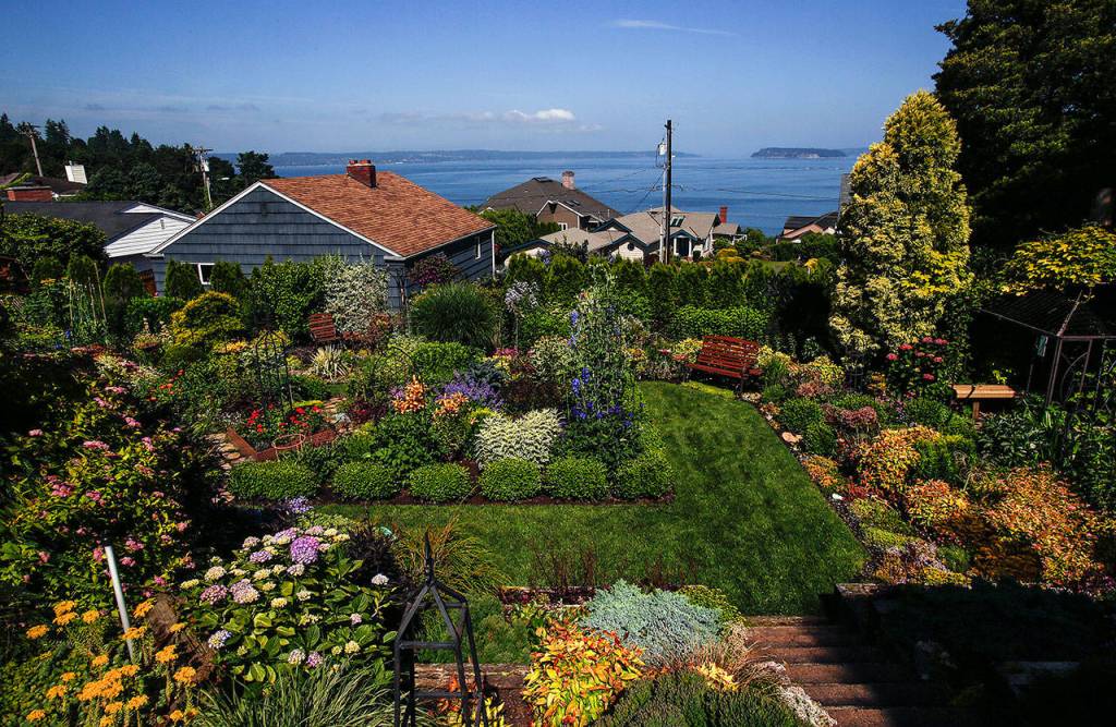 This year&rsquo;s tour of gardens and quilts features Janice Tallman&rsquo;s garden, which is so packed with blooms people call it &ldquo;The Butchart Garden of Everett.&rdquo; The view is great, too! (Dan Bates / The Herald)