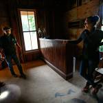 Blair Corson enters a small room on the southwest corner of the hotel where his wife, Kathy, waits. He carries a flashlight, which he&rsquo;ll use to illuminate something special he found near the bottom of an old staircase in the next room. It is the signature of the original owner of the building, Clarence Bush, who moved to Index in 1899 with his wife, Ella. (Dan Bates / The Herald)