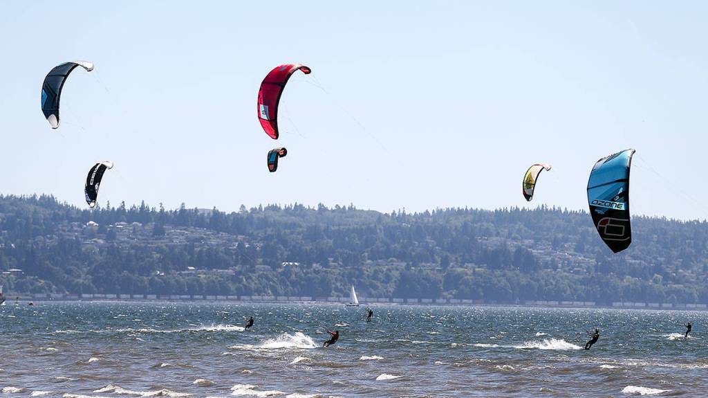 Kites dot the horizon during the Jetty Island Light Wind Olympics on Jetty Island on June 23. (Kevin Clark / The Herald)