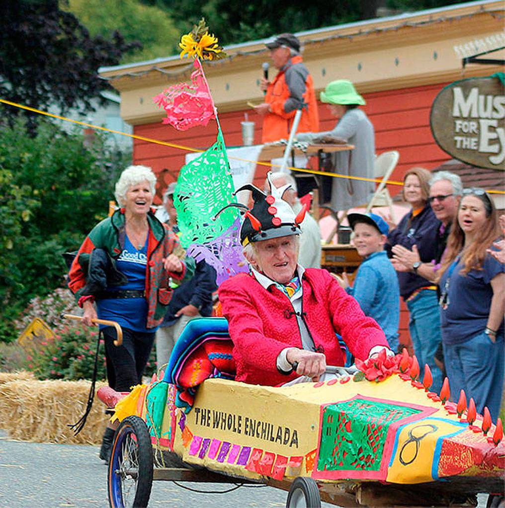 Peter Lawlor competes in Langley&rsquo;s 2016 Soup Box Derby that&rsquo;s a race to raise money for local food banks. He said he plans to enter his jalopy, &ldquo;The Whole Enchilada&rdquo; again this August, maybe with a different sauce. Running close behind him is his daughter, Gretchen Lawlor. (Photo by Kyle Jensen/South Whidbey Record)