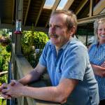 Janice Tallman and her husband, Steve, enjoy a view overlooking the unique and beautiful garden that winds around their home. (Dan Bates / The Herald)