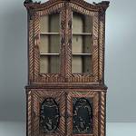 This is a bookshelf and cabinet made for a house furnished in Adirondack or Rustic style. It is 86 inches high and 46 inches wide. The chest is signed &ldquo;DZ JR&rdquo; in the wood. Its price is $6,150. (Cowles Syndicate Inc.)