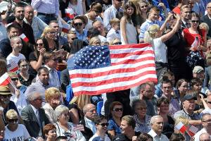 Trump welcomed by cheering, flag-waving supporters in Warsaw