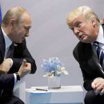 Trump confronts Putin on election hacking in first meeting