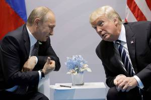 Trump confronts Putin on election hacking in first meeting