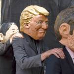 Axel Heimken / dpa                                Demonstrators against the G20 Summit stand on stage wearing masks depicting (from left): British Prime Minister Theresa May, Japan&rsquo;s Prime Minister Shinzo Abe, President Donald Trump and French President Emmanuel Macron, in Hamburg, Germany on Sunday.