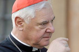 Pope removes a top cardinal as sex abuse crisis heats up