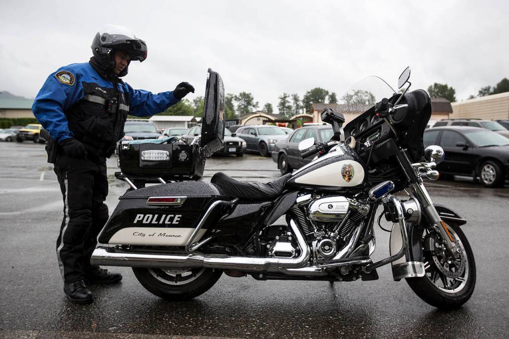 Monroe traffic officer Javier Patton prepares to head out for patrol on June 8. (Ian Terry / The Herald)                                Monroe traffic officer Javier Patton prepares to head out for patrol on Thursday, June 8. (Ian Terry / The Herald)