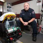 Lynnwood Fire Department paramedic Vincent Schweitzer, 61, poses in the paramedic unit at Station 15 on July 27 in Lynnwood. Schweitzer is the last paramedic still on the job from a starting group of seven in south Snohomish County. (Andy Bronson / The Herald)