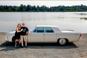Almost as if out of an early &rsquo;60s magazine ad for the new Lincoln Continental, Vicki and Ron Selia park alongside Lake Cassidy to show off their newly acquired 1961 model that was once owned by actress Mary Pickford. (Dan Bates / The Herald)