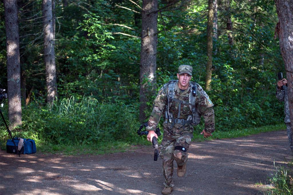 Sgt. Grant Reimers, a heavy vehicle driver with 1859th Light-Medium Transportation Company, Nevada National Guard, rounds the corner to the finish line of the 13.1-mile ruck march through Itasca State Park, Minn., for the 2017 Army National Guard Best Warrior Competition on July 20. The Soldiers completed a grueling three-days of military skill, strength, and endurance events prior to the ruck march. (Minnesota National Guard / Sgt. Sebastian Nemec)