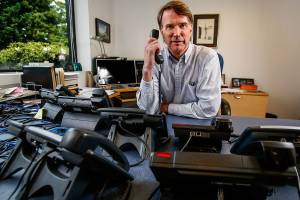 As president of Teo Technologies in Mukilteo, Steve Hill can have as many telephones as he wants on his office desk, including some really high tech phones that can help defend against wire tapping. (Dan Bates / The Herald)