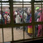 Kenyans line up to vote in Bissil, 75 miles south of Nairobi, Kenya, on Tuesday. (AP Photo/Jerome Delay)
