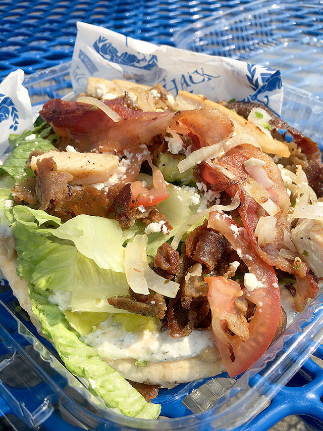 Gyro Shack&rsquo;s Ultimate gyro is basically a meat-lover&rsquo;s pita sandwich. It has gyro meat, an 80/20 percent beef/lamb mixture with bacon, chicken, tomato, onion, lettuce, feta and tzatziki sauce. (Ben Watanabe / The Herald)