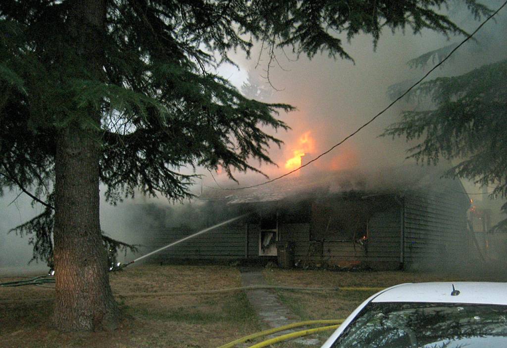 Two people suffered smoke inhalation in a house fire early Sunday north of Bothell. (Snohomish County Fire District 1)