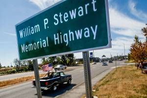 Southbound drivers get a glimpse of a new state highway sign near Everett Mall Tuesday that designates the William P. Stewart Memorial Highway. Last year, Highway 99 was renamed to recognize Stewart, an African-American Civil War veteran who settled in Snohomish County after serving with the Union Army.