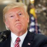 President Donald Trump listens to a question while meeting the media in the lobby of Trump Tower in New York on Tuesday. (AP Photo/Pablo Martinez Monsivais)