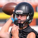 Monroe quarterback Jaedyn Prewitt throws during practice Aug. 16, 2017, at Monroe High School. (Kevin Clark / The Herald)