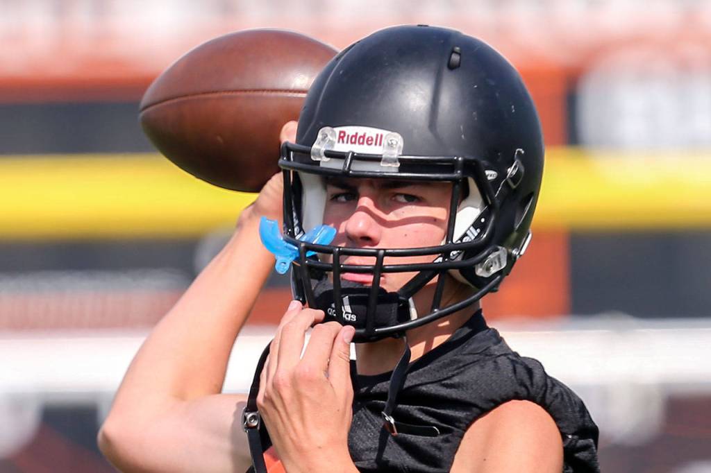 Monroe quarterback Jaedyn Prewitt throws during practice Aug. 16, 2017, at Monroe High School. (Kevin Clark / The Herald)
