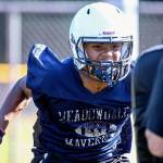 Meadowdale senior Jashon Butler attacks a pad during practice Aug. 17, 2017, at Meadowdale High School in Lynnwood. (Kevin Clark / The Herald)