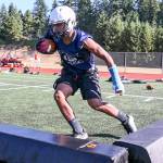 Meadowdale senior Jashon Butler runs through agility drills during practice Aug. 17, 2017, at Meadowdale High School in Lynnwood. (Kevin Clark / The Herald)