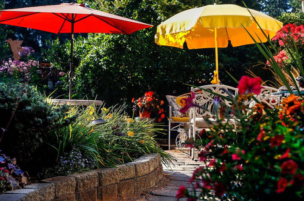 Jim Mathis and his wife, Susan Hansberry, have created a unique and personal garden. (Dan Bates / The Herald)