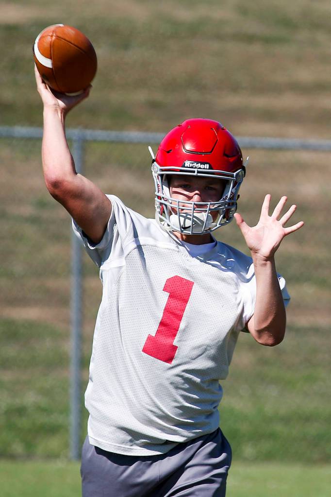 Stanwood quarterback Karl DeBoer practices on Aug. 17, 2017. (Ian Terry / The Herald)
