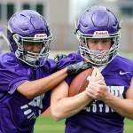 Sohin Mehta, left, works to free the ball from Kristian Brusa during practice Friday afternoon at North Creek High School in Bothell on August 18, 2017. (Kevin Clark / The Herald)