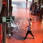 In this watermarked frame grab from surveillance video, a suspect. believed to be Younes Abouyaaqoub, is seen walking through La Boqueria market seconds after a van crashed into pedestrians in Barcelona on Thursday. (EL Pais, via AP)