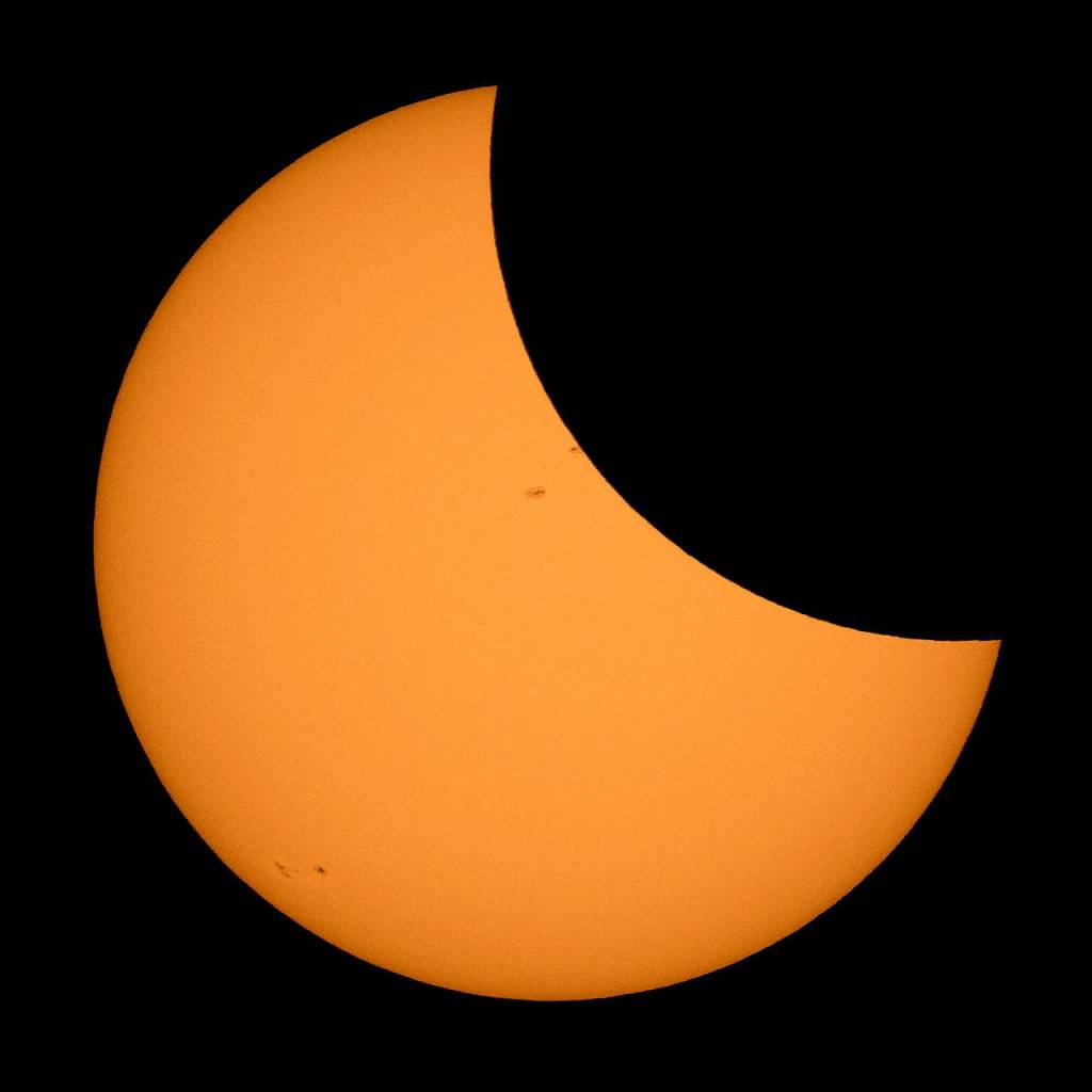 The moon passes in front of the sun during the solar eclipse near Ross Lake in North Cascades National Park on Monday. (Bill Ingalls/NASA via AP)