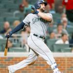 Seattle&rsquo;s Yonder Alonso (10) hits a run-scoring double in the sixth inning of the Mariners&rsquo; 6-5 win over the Atlanta Braves on Monday in Atlanta. (AP Photo/Todd Kirkland)
