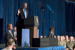 Questions on immigration, race follow Trump to Arizona