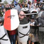 In this Aug. 12 photo, white nationalist demonstrators use shields as they guard the entrance to Lee Park in Charlottesville, Virginia. (AP Photo/Steve Helber, File)