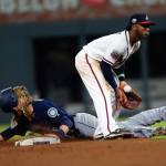 Seattle&rsquo;s Taylor Motter steals seconds base as Atlanta&rsquo;s Ozzie Albies handles the late throw in the eighth inning of Wednesday&rsquo;s game in Atlanta. (AP Photo/John Bazemore)