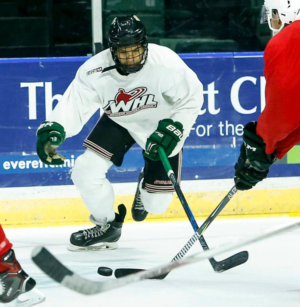 Silvertips prospect Nathanael Hinds battles for a loose puck during the second day of Everett&rsquo;s training camp at Xfinity Arena on Aug. 25, 2017. (Ian Terry / The Herald)