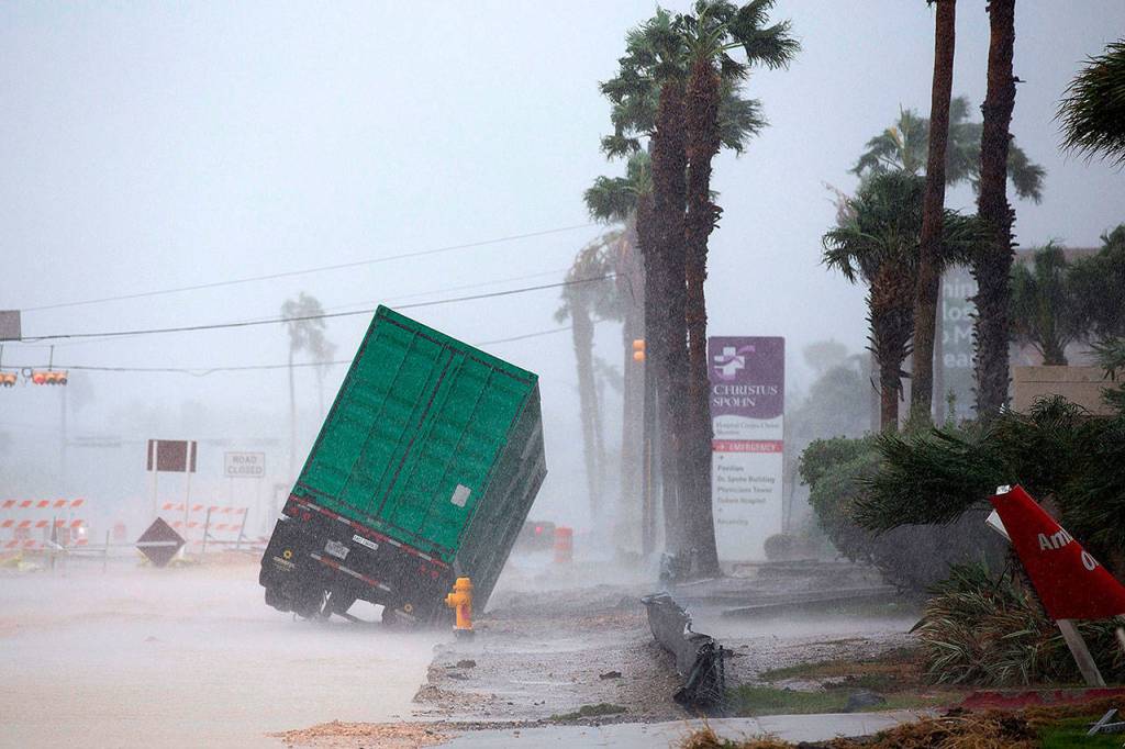A power generator tips in front of Texas&rsquo; CHRISTUS Spohn Hospital in Corpus Christi, Texas, as Hurricane Harvey hits Friday. (Courtney Sacco /Corpus Christi Caller-Times via AP)
