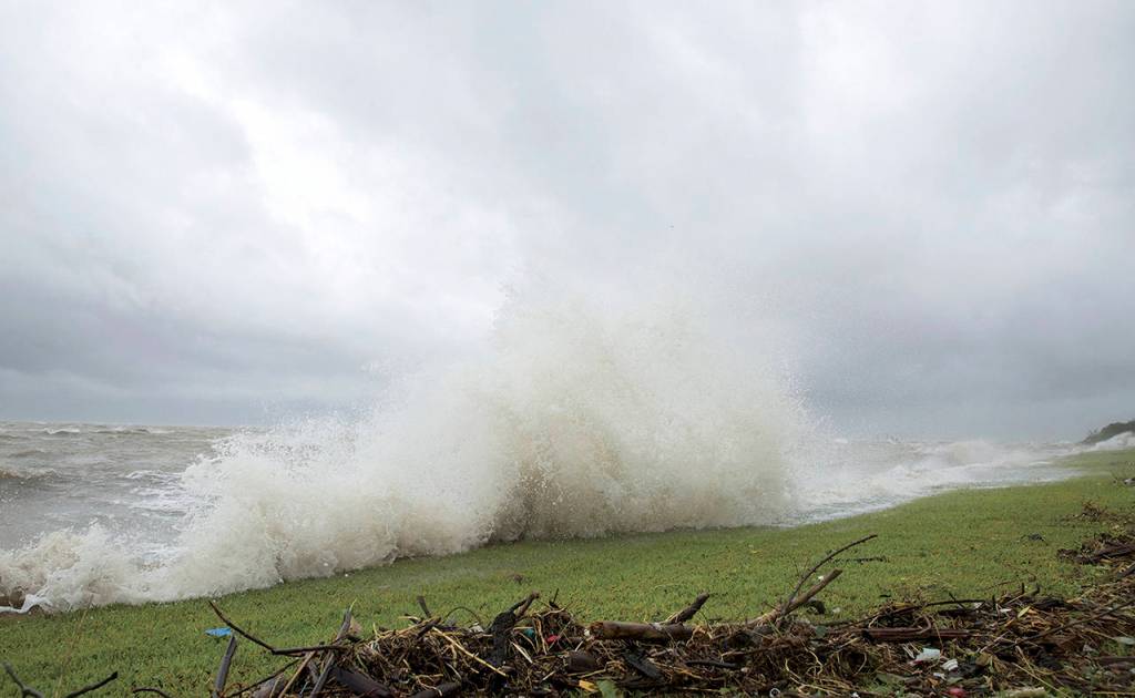 Water crashes along the bay front in Port Lavaca, Texas, on Friday. (Ana Ramirez/The Victoria Advocate via AP)
