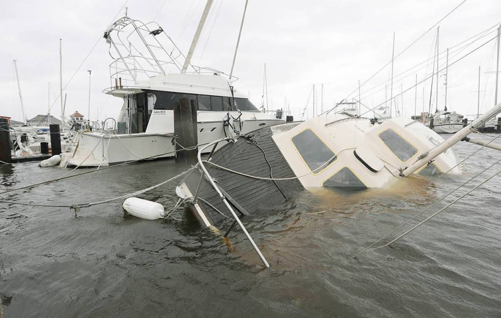 A boat is partially submerged in the wake of Hurricane Harvey on Saturday in Rockport, Texas. (AP Photo/Eric Gay)