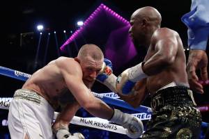 Mayweather TKOs McGregor in 10th, improves to 50-0